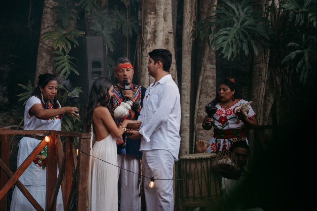 Mayan ritual with smoke performed over the couple during a spiritual cenote wedding in Mexico