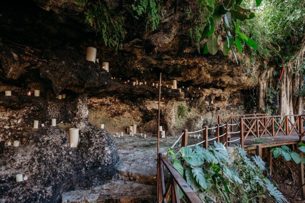 Scenic view of a cenote surrounded by lush jungle used as a destination wedding venue in Mexico