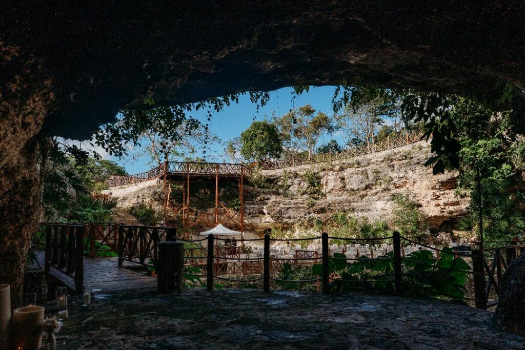 Natural cenote ceremony space surrounded by jungle used for destination weddings in Quintana Roo