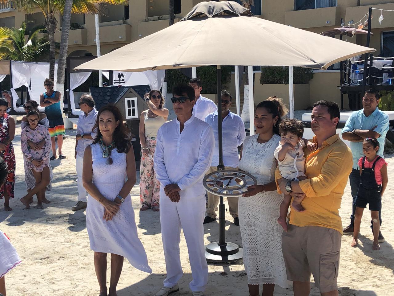Children and family taking part in an outdoor ceremony