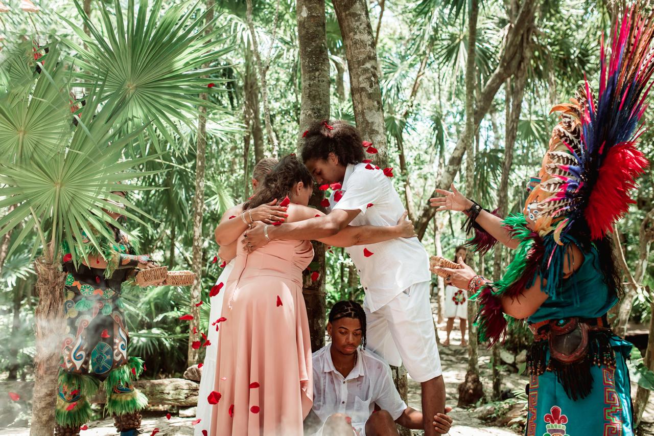 Embrace during a closing cycle ceremony in the jungle