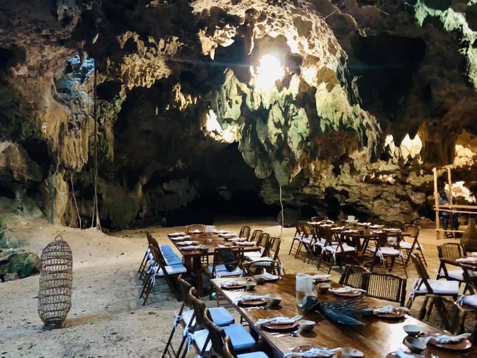 Dinner tables set for the reception inside the cave