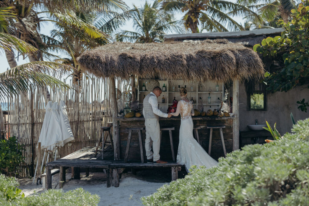 Couple walking through jungle pathway during spiritual wedding ceremony in Tulum Riviera Maya