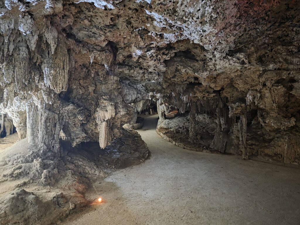 Spacious underground cenote cave in Riviera Maya prepared for spiritual wedding ceremony