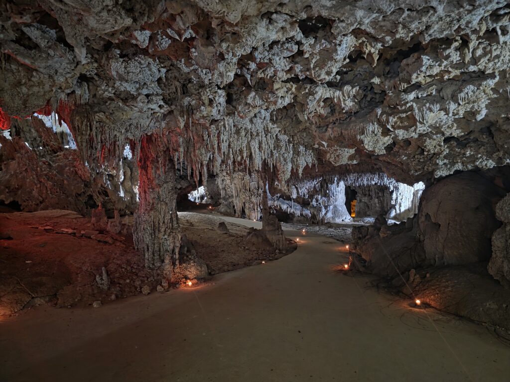 Ambient-lit cenote cave in Tulum designed for private spiritual wedding event
