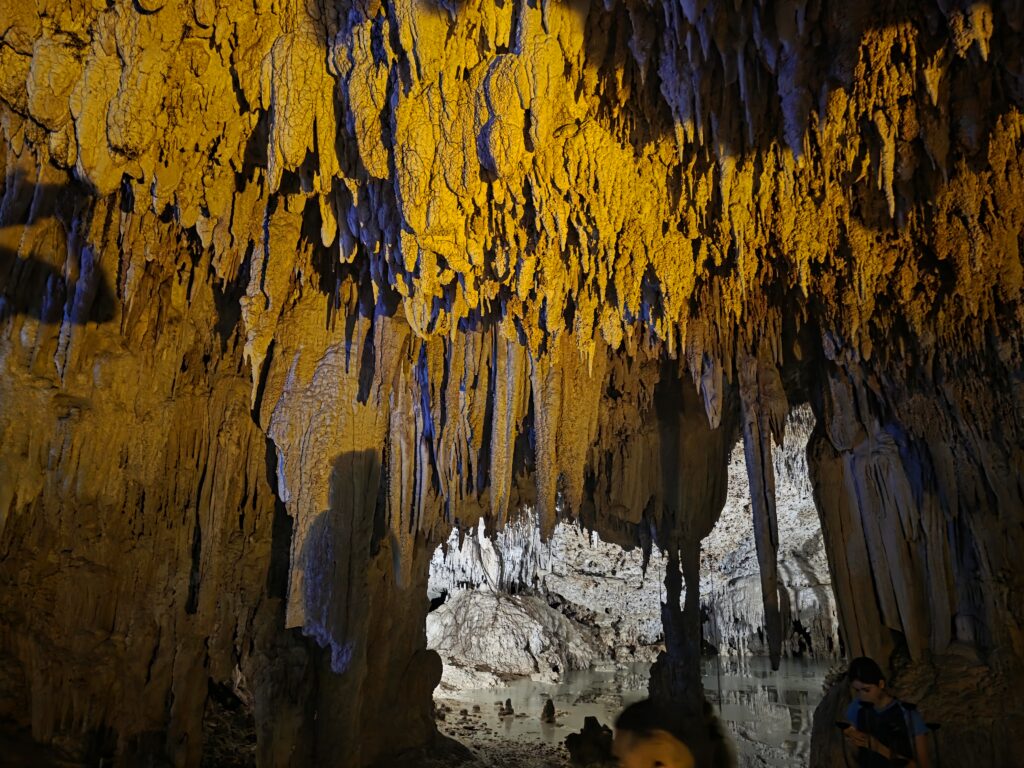 Stalactite formations inside sacred cenote cave used for spiritual ceremony in Mexico