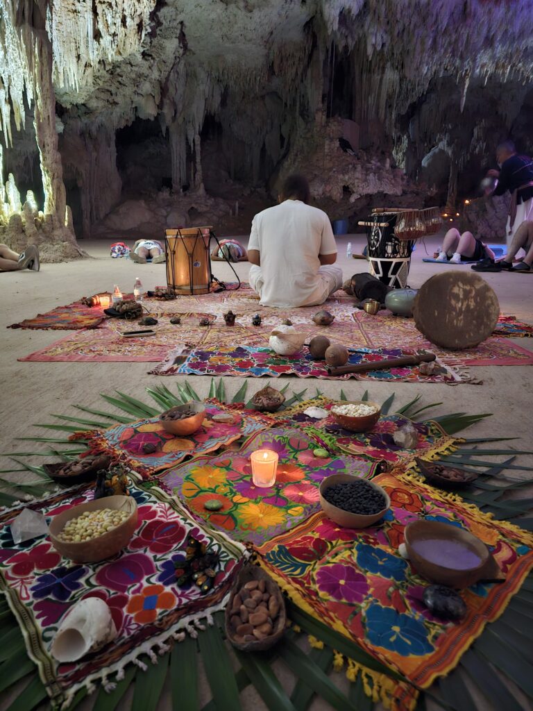Colorful ceremonial altar with sacred elements prepared for Mayan-inspired ritual in cenote cave